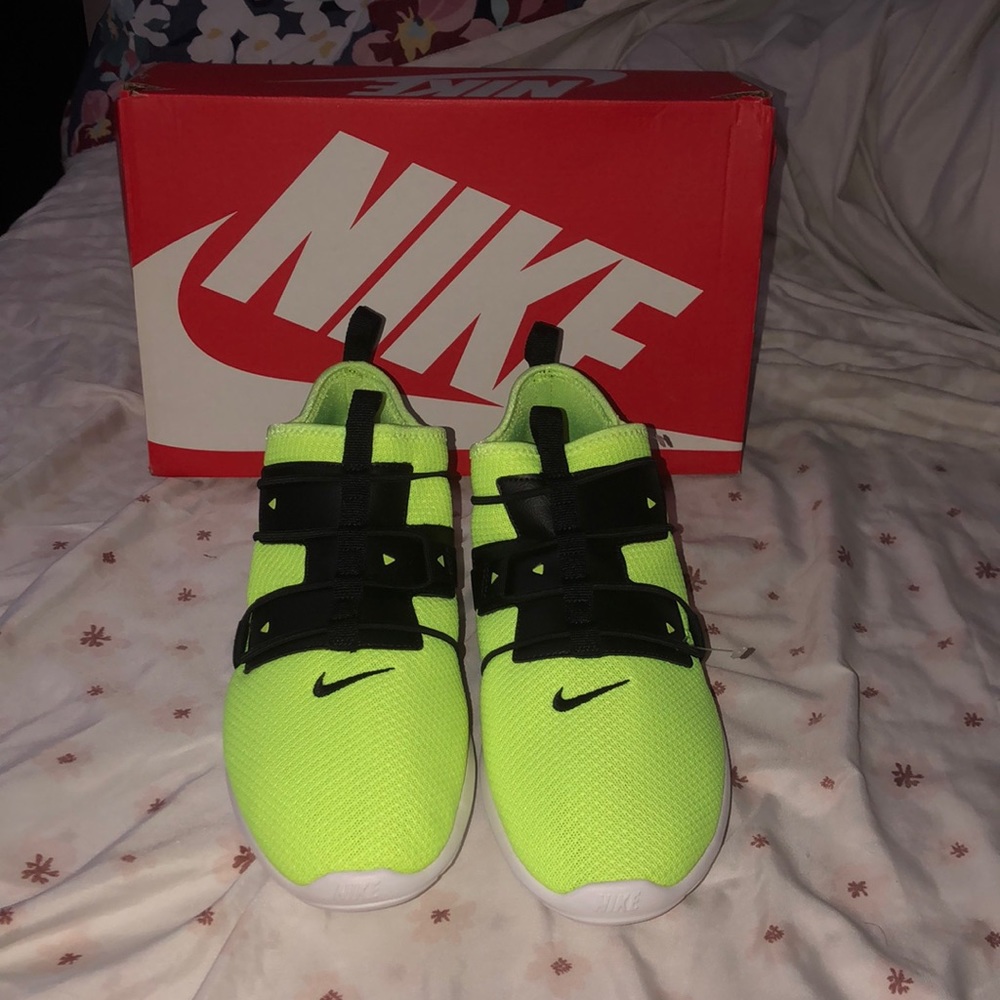 Neon green and black sneakers with white soles